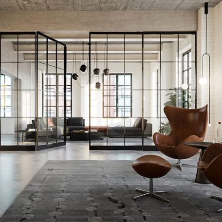 Modernes Loft-Büro mit Glaswänden, Ledersessel und großen Fenstern, industrieller Stil. HANSEL.kraus metalltechnik gmbh